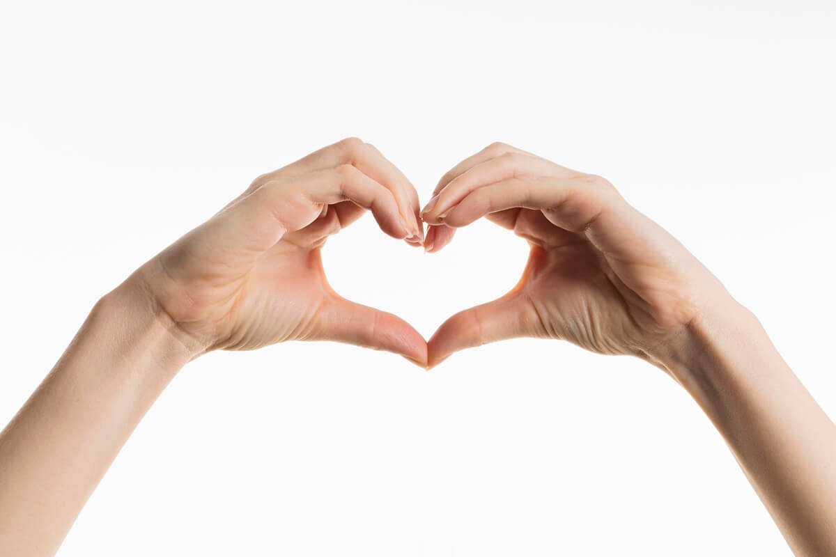 front view hands showing heart sign